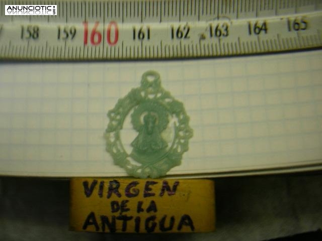 MEDALLA VIRGEN DE LA ANTIGUA EN ORO Y EN PLATA.